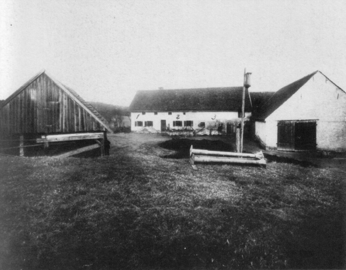 A historical photograph of the Hinterkaifeck farmstead in Bavaria, the isolated farm where six people were murdered in 1922.